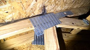 Water damaged roof decking,. Visible wood damaged inside the attic